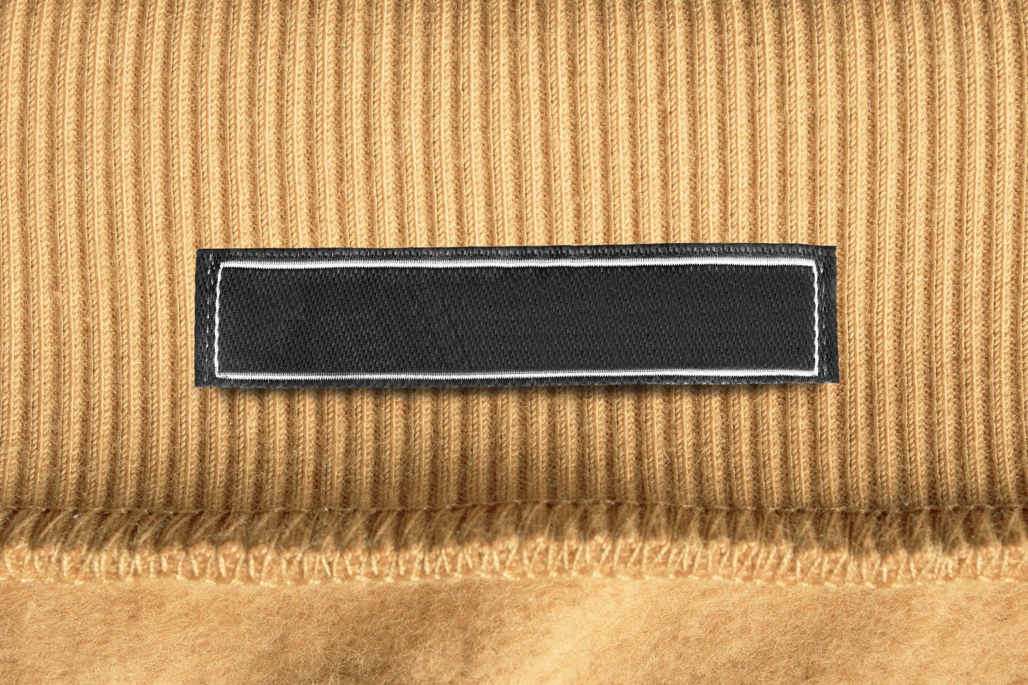 stack of embroidered patches and labels
